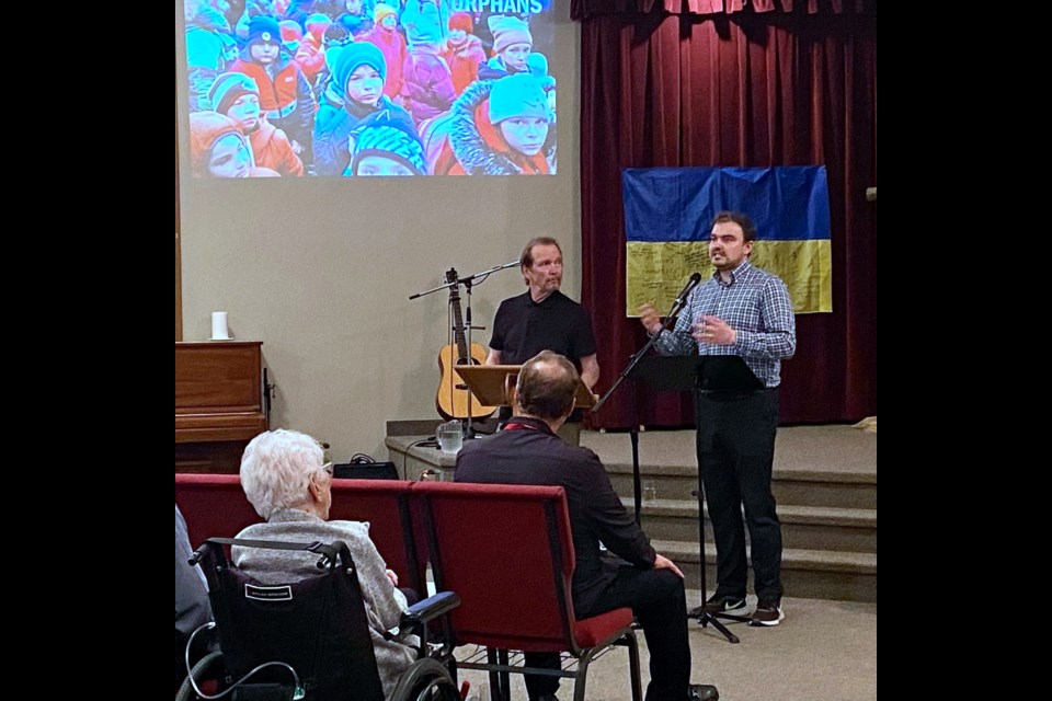 Lloyd Cenaiko, left, a founder and executive director of Humanitarian Aid Response Team, and Kostya Voloshyn, the director of HART'S Ukrainian affiliate, speak on Saturday, June 18 at the Bergen Missionary Church during a fundraiser and informational presentation about the Humanitarian Aid Response Team’s ongoing efforts to provide relief for Ukrainian refugees. 
Submitted photo