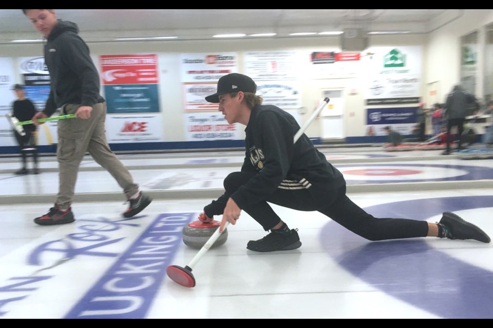 Daniel Schmitt, playing with the rink from Olds High School, throws a rock on Tuesday, Jan. 16 during a game against the Sundre High School team that was hosted by the Sundre Curling Club.
Simon Ducatel/MVP Staff 