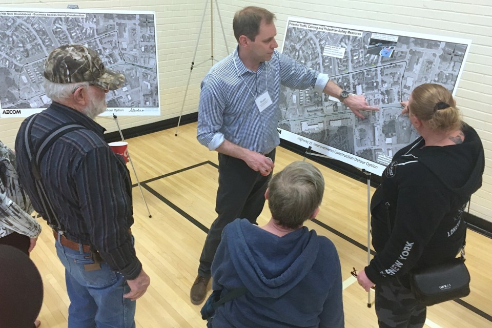 Stuart Richardson, an infrastructure project manager with Alberta Transportation and Economic Corridors, answers questions from people who came out to the Sundre Community Centre on Wednesday, April 24 to learn more about the planned detour that soon will be in place once the municipality resumes construction work to complete upgrades on underground infrastructure before Transportation and Economic Corridors takes on the Highway 27-Main Avenue overlay project. 
Simon Ducatel/MVP Staff