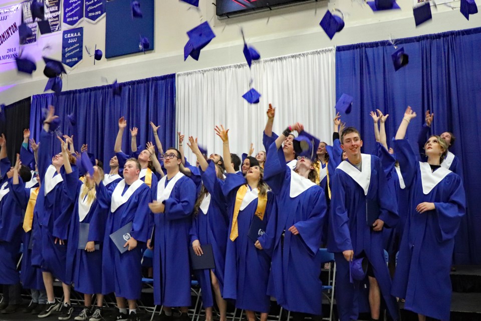 Graduating students of Innisfail High School and Innisfail Career High School toss their mortarboards at the end of their graduation ceremony on June 3. Johnnie Bachusky/MVP Staff