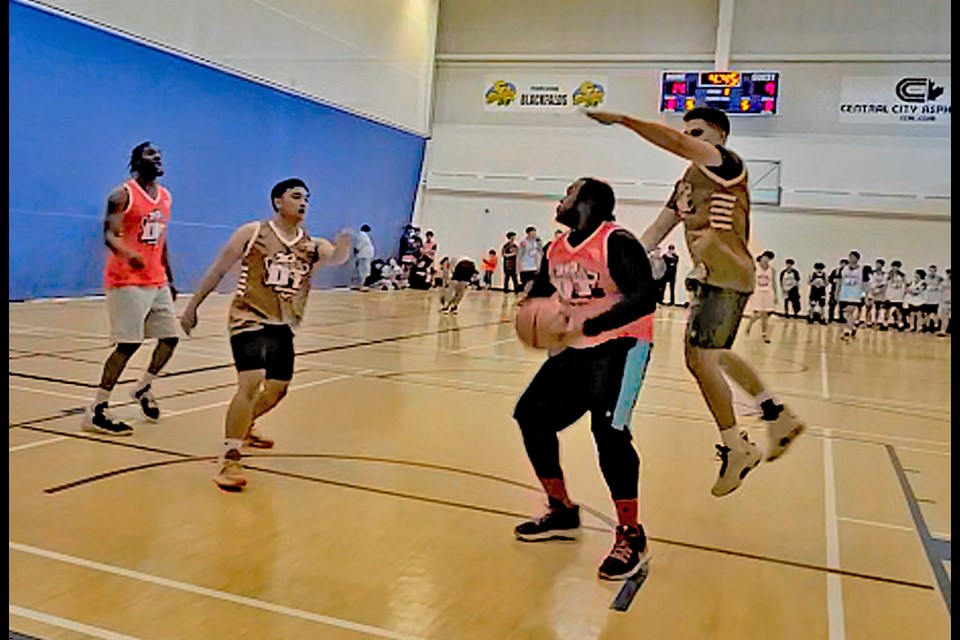 Rollin Morris looks to pass or shoot during a 3-on-3 tourney in Blackfalds last fall. Morris is now organizing the first-ever 3-on-3 tourney in Innisfail on Feb. 18. Submitted photo