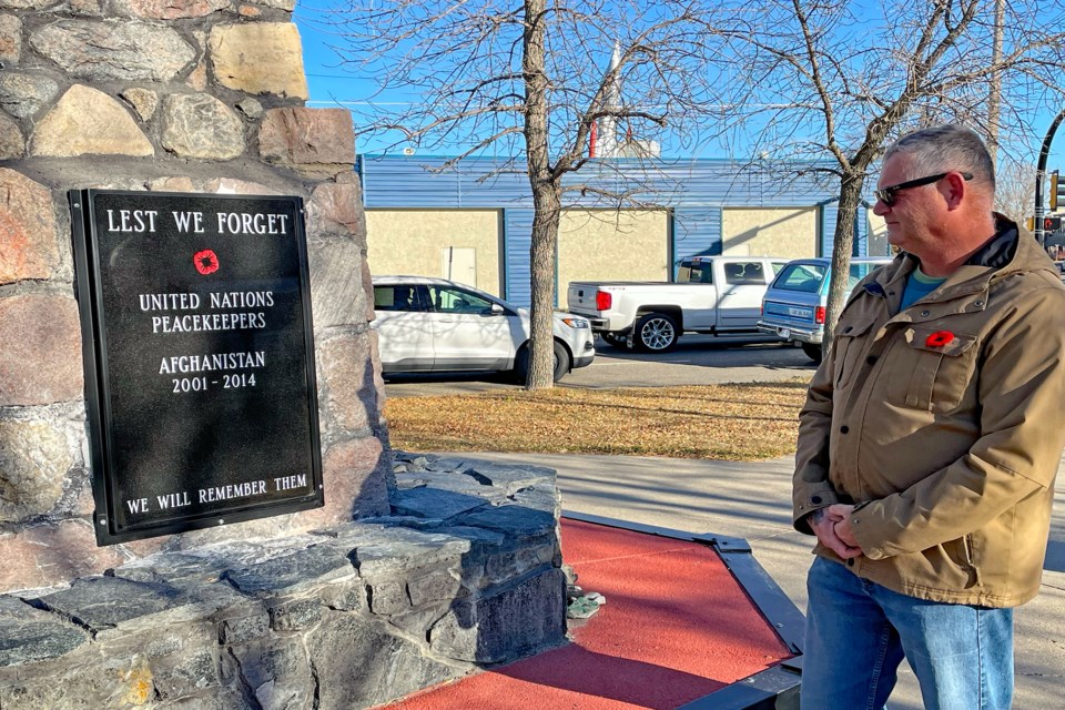 Innisfail veteran Doug Holsworth, who spearheaded the cenotaph plaque project for Canadian peacekeepers on United Nations missions and veterans of the Afghanistan campaign, reflects for a moment in front of the recent installation on Oct. 31. Johnnie Bachusky/MVP Staff