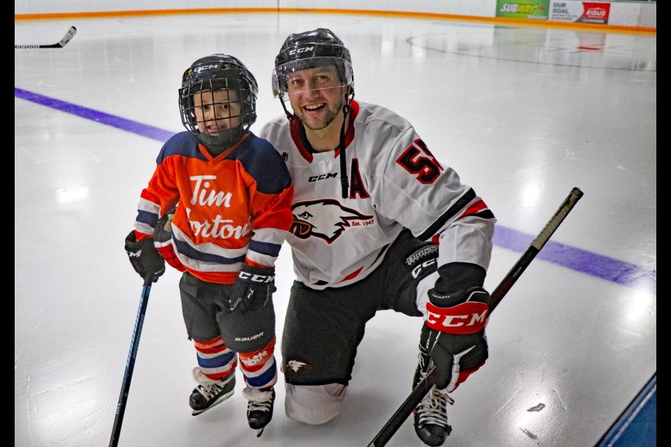 Innisfail Eagles assistant captain Chad Robinson joins his four-year-old son Hunter, a member of the Innisfail Tim Hortons Eaglets, to play in the Eaglets scrimmage during the first intermission of the Eagles game on Feb. 17. Johnnie Bachusky/MVP Staff 