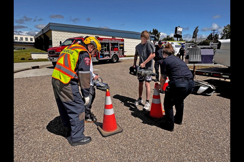 There were four learning stations set up at the Innisfail High School on June 19 for students interested in the new Fire Cadet Program, and all the lifesaving duties a firefighter must learn. Johnnie Bachusky/MVP Staff