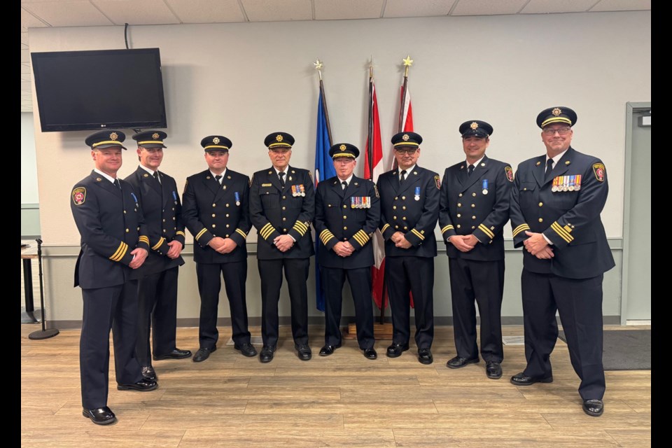 During the evening of May 20 at the Innisfail Golf Club 11 members of the town’s Protective Services Department received federal and provincial recognition for their long-standing service. From left to right are Assist. Chief Mike Thomson, Capt. Jaymie Hendrick, Capt. Shawn Jacobsen, Deputy Chief Dennis Fehr, Director of Protective Services Gary Leith, Capt. Kevin Fedorchuk, Capt. Shawn Ludlow and Assist. Chief Clark Maldaner. Missing from the photo are local medal winners Peace Officer Sgt. Derek Radatzke, Assist. Chief Tim Ainscough and Pump operator Dan Urban. Submitted photo