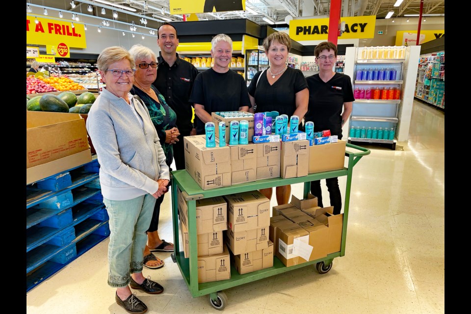 Members of a trio of Innisfail institutions gather on Sept. 12 at Paul's NOFRILLS to support the town's vulnerable citizens with personal hygiene items under the Rotary Club of Innisfail's Food Bank Support Program. From left to right is Heather Taylor, coordinator of the Innisfail and District Food Bank; Diana Cooper, the agency's treasurer; Paul Begg, the new owner of Paul’s NOFRILLS Innisfail; Valerie Davies, executive coordinator of the food bank, and Michelle Tokaryk, grocery manager at the local NOFRILLS. Johnnie Bachusky/MVP Staff