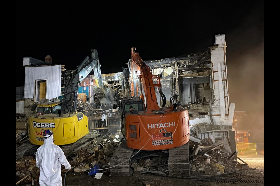 The back of Innisfail's 115-year-old Globe Coliseum building being ripped apart by a pair of excavators during the evening of Nov. 8. 
Johnnie Bachusky/MVP Staff