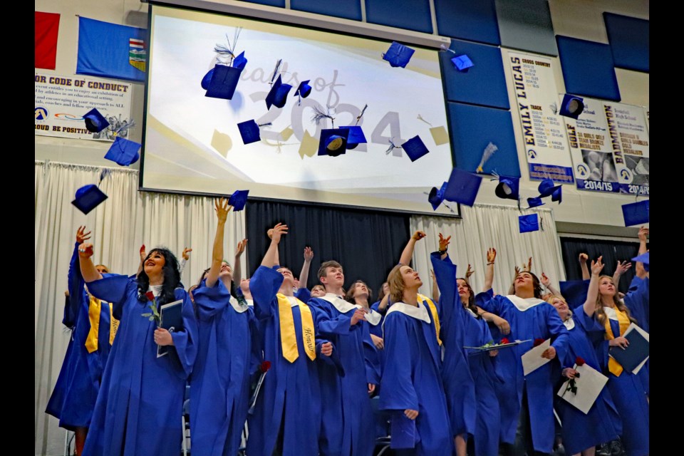 The 2024 graduating class of 85 students at Innisfail High School proudly engaged in the traditional mortarboard toss at the end of their graduation ceremony on June 7. Johnnie Bachusky/MVP Staff