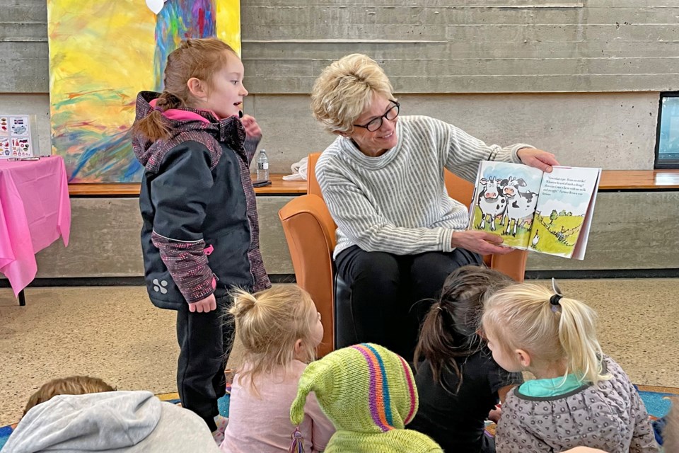 Mayor Jean Barclay reads Doreen Cronin's Click, Clack, Moo: Cows That Type to children to open the fifth annual Family Literacy Festival at the Innisfail Library/Learning Centre on Jan. 28. Johnnie Bachusky/MVP Staff