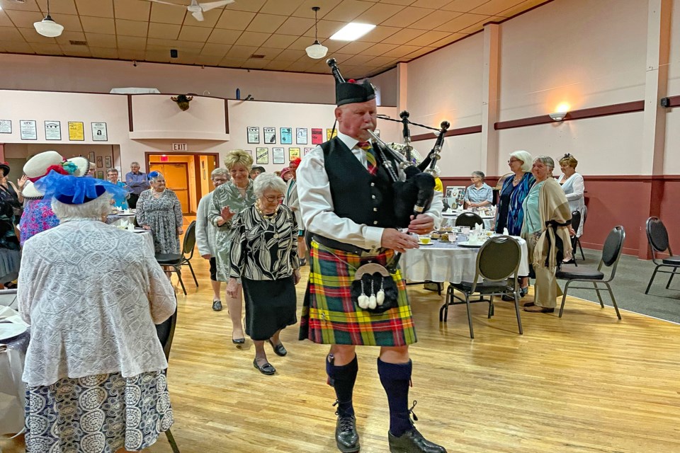 Innisfail bagpiper Bryn Chambers opens the Queen's Platinum Jubilee Tea with an old-fashioned tune at the town's Ol' Moose Hall. The sold-out three-hour event was held to honour Queen Elizabeth's remarkable 70-year service to the citizens of the United Kingdom, the realms and the Commonwealth, including Canadians from coast to coast. Johnnie Bachusky/MVP Staff