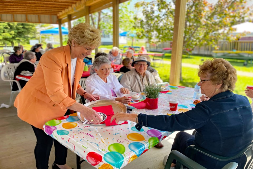 Innisfail mayor Jean Barclay serves pie and ice cream to seniors during the annual Seniors Week Garden Party on June 8 at the Innisfail and District Historical Village. Due to COVID-19 provincial restrictions it was the first time since 2019 the event was held. Johnnie Bachusky/MVP Staff
