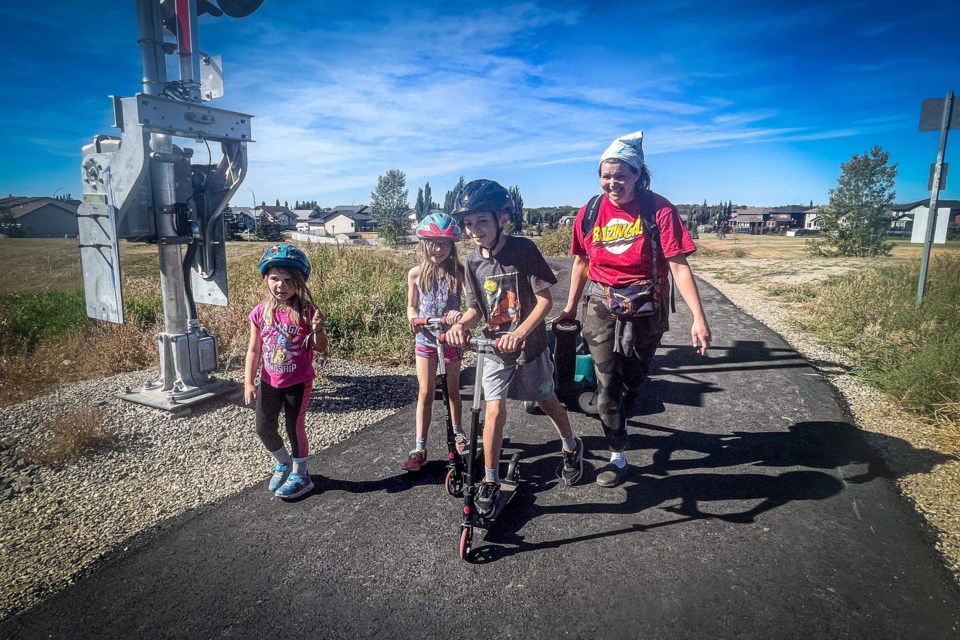 The Peake family of Penhold is set to cross the rail tracks at White Rock Crossing on Sept. 18 during Innisfail's Terry Fox Run on Sept. 18. From left to right is six-year-old Anya, her nine-year-old sister Inara, big brother Xavier and mom Katrina. 
Photo by Candice Hughes