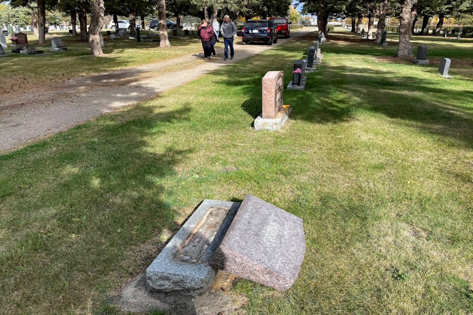 A steady stream of citizens went through the east side of the Innisfail Cemetery on Oct. 13 to view the toppling and damage to 100 tombstones that was caused be vandals. Johnnie Bachusky/MVP Staff