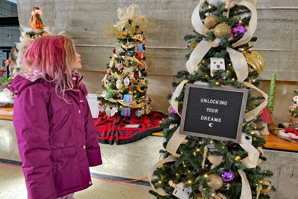 Eight-year-old Innisfailian Sophia Thompson gazes at a decorated Christmas tree entrant at this year's second annual Innisfail Festival of Trees at the Innisfail Library/Learning Centre. The 10-day festival, which began on Nov. 25, runs until Dec. 4. The event is a fundraiser to support the community's less fortunate over the holiday season. 
Johnnie Bachusky/MVP Staff