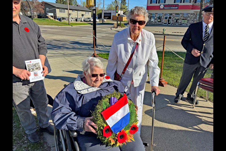 Mary Huntly, left, with her wreath for the Netherlands and Ann Vanderham at the special Innisfail Cenotaph ceremony on May 8 to mark the 80th anniversary of VE-Day. Vanderham was a child living in the Netherlands in 1940 when the Nazis occupied her country. Huntly's brother Tom was a Canadian soldier killed in combat in 1945 during a long mission to liberate the Netherlands. Johnnie Bachusky/MVP Staff
