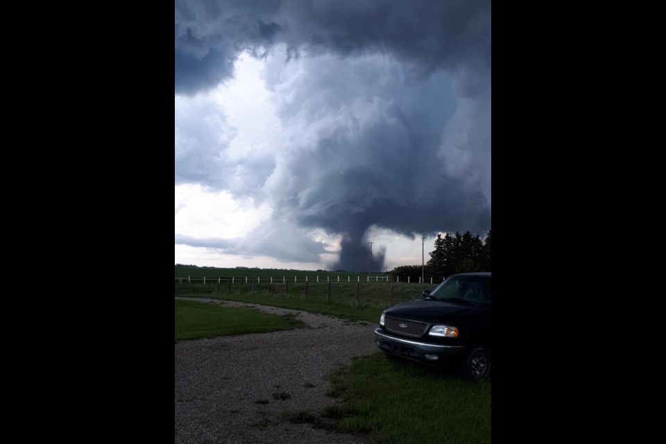 From a neighbour’s house, the twister can be seen wreaking havoc. 