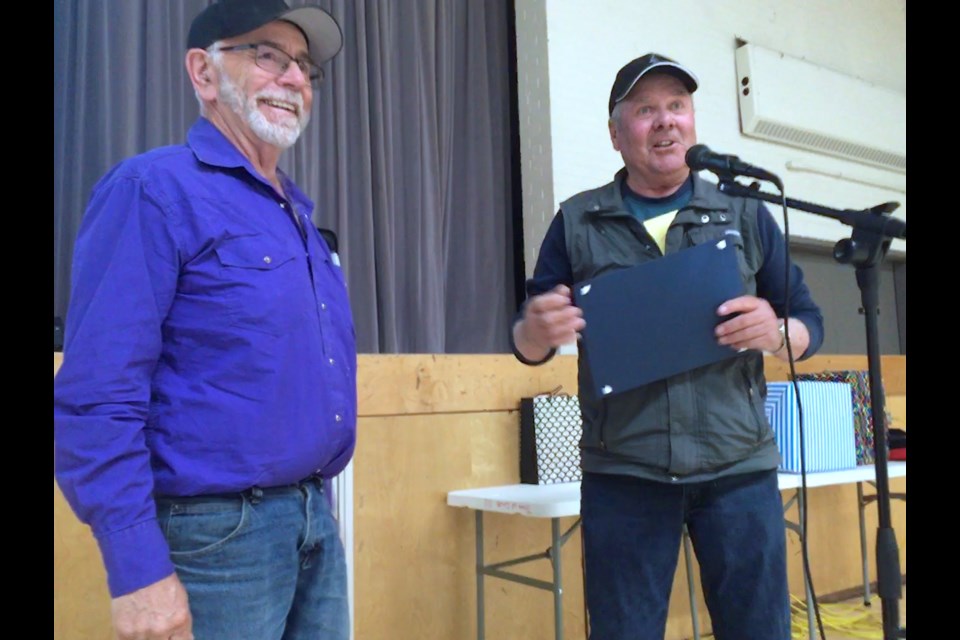 Jim Peters, right, who originally hired John "Bubba Louie" Nelson back in 1979, shared some thoughts and presented his friend and former colleague with a certificate on Thursday, May 26 during a special ceremony celebrating Nelson's retirement. 
Simon Ducatel/MVP Staff