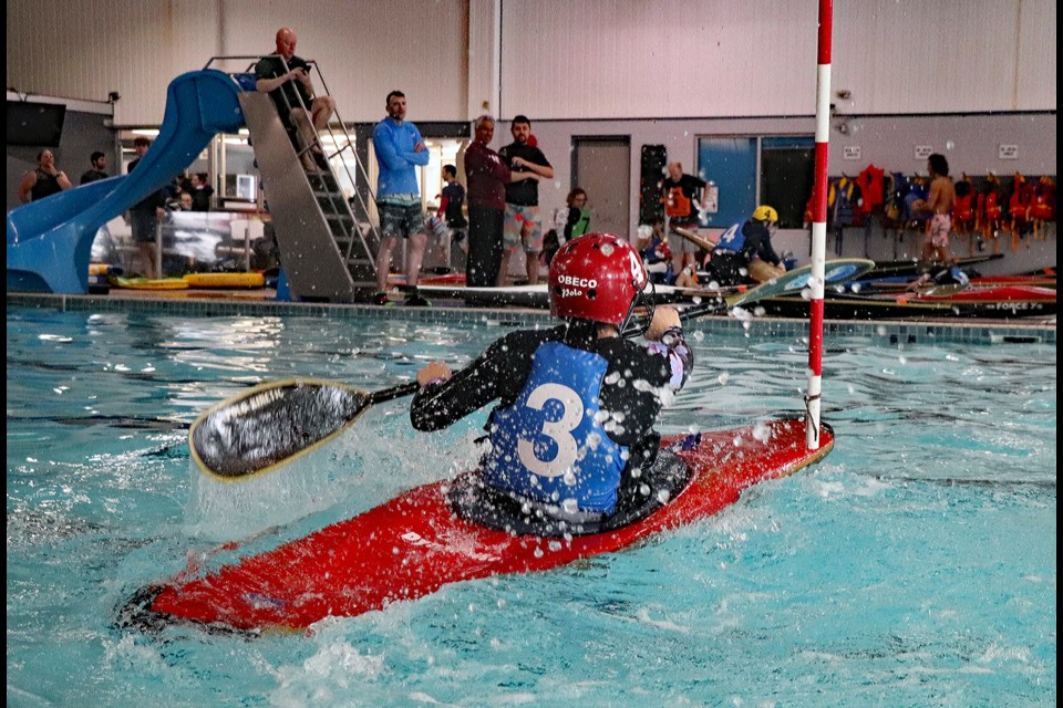Sidney McCarthy of Edmonton splashes hard around the turn of the slalom course at the annual Cottonwood Kayak Polo Tournament on March 2 at the Innisfail Aquatic Centre. Johnnie Bachusky/MVP Staff