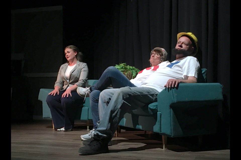 Although the Sundre Arts Development Centre was not quite packed to capacity on Friday, May 5 for the Peak Theatre Players' opening show of Knickers! A Brief Comedy, a play written by Sarah Quick, the house was nevertheless fairly full for the uplifting production about perseverance against the odds. From left: Rachel Klapp took on multiple secondary roles, including an interviewer seeking insight on the impact the closure of the paper mill at Elliston Falls – the small rural community's main economic driver – had on the longtime employees who were laid off, played here by Tracy Hooch-Antink and Jim Eklund. 
Simon Ducatel/MVP Staff