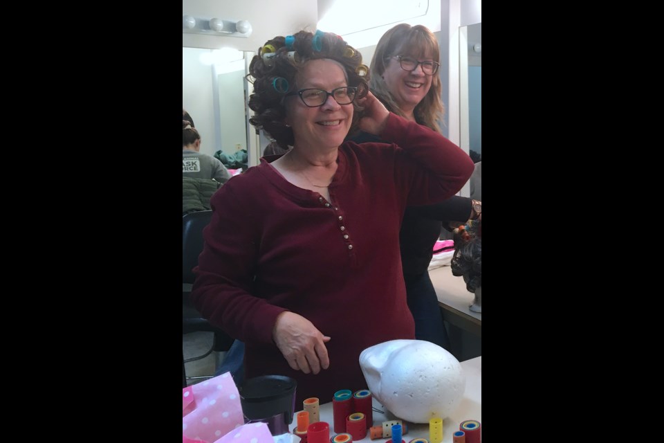 Members of Peak Theatre Players have recently been rehearsing for five performances of a production called Knickers! a 'Brief' Comedy. Colette Belanger, left, dons a wig after loading up a bunch of curlers alongside castmate Anne-Marie Jonke in the change room in preparation for a rehearsal last week.
Simon Ducatel/MVP Staff