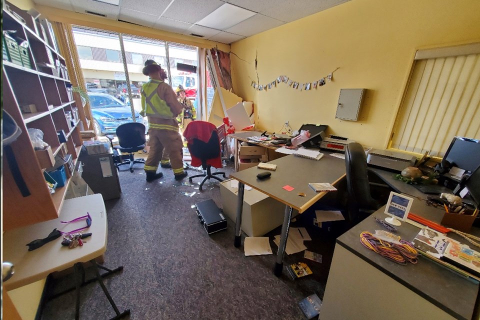 Didsbury Fire Department members inside the damaged Didsbury Library.
Photo courtesy of RCMP