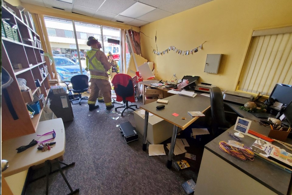 Didsbury Fire Department members inside the damaged Didsbury Library.
Photo courtesy of RCMP
