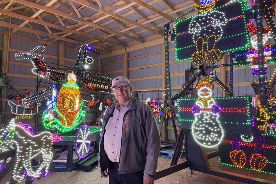 Doug Bos, co-owner of Discovery Wildlife Park, in his new storage building with some of the spectacular winter and Christmas-time light displays he purchased last year for his ambitious Light the Night drive-thru project that is scheduled to run from Nov. 19 to Jan. 15. Johnnie Bachusky/MVP Staff