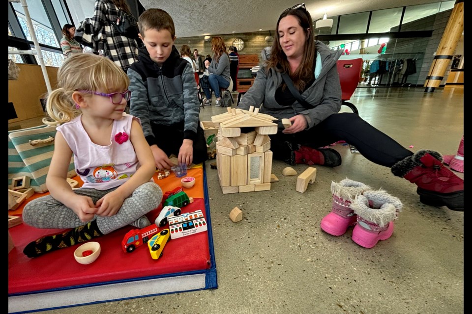 Kids and parents had plenty of fun around many different learning activities at the Innisfail Family Literacy Day on Jan. 27 at the Innisfail Library/Learning Centre. From left to right is five-year-old Lyra Teufel, nine-year-old Jace Reynolds and his mom Tara Reynolds. Johnnie Bachusky/MVP Staff