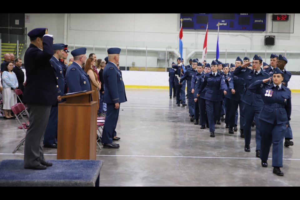 Salutes are exchanged as the cadets march past Royal Canadian Legion Branch #105 president Sheila Peters who undertook the inspection.