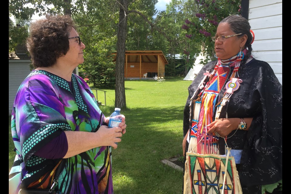 The Sundre & District Museum's historic village hosted on Tuesday, June 21 some activities in recognition of National Indigenous Peoples Day. After a tipi was set up by the David Bearspaw family, who are from the Stoney Nakoda Nation, several members of the nation remained at the museum grounds to answer questions as part of ongoing reconciliation efforts. Gloria Snow, right, a member of the Stoney Nakoda Nation, which is also known as Mini Thni – the Stoney word meaning "cold water" – was present to meet with people who came out with open minds to learn about their history. Here, she was chatting with Jane Atkins, chair of the Sundre & District Historical Society. In terms of reconciliation work, Snow said these kinds of public engagements are a way to not only raise cultural awareness about First Nations, Métis, and Inuit people but also to build and develop relationships as well as share the stories of their ancestors. 
Simon Ducatel/MVP Staff