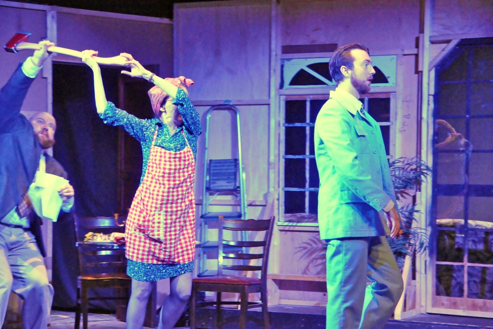 Jackie Moorhouse's character, centre with axe, in Noises Off added to the mayhem of the production. The veteran local actor said the key to ITT's success for the challenging comedic play was timing. Photo by Jim Carroll