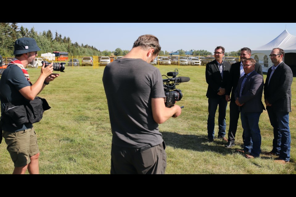 Olds College president Ben Cecil, Nufarm country lead Boyd Bergstrom, Olds College vice-president of development Todd Ormann and former Nufarm, now Nuseed portfolio manager for Canada Graham Collier pose for photographers after announcing their partnership.
