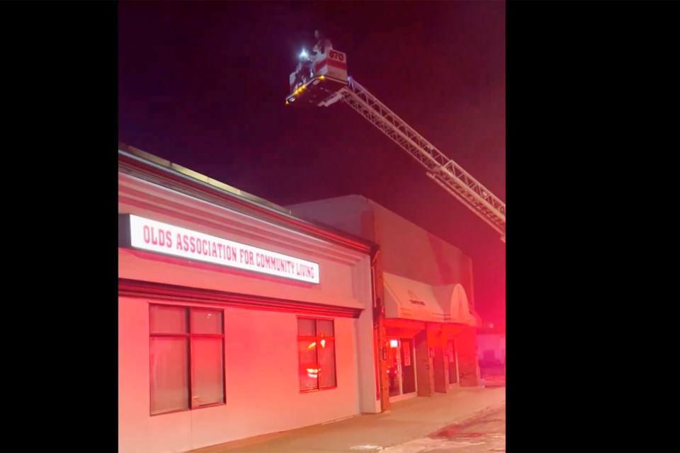 The Olds Fire Department used its aerial truck Friday night to douse a fire in Olds Association for Community Living's garage.