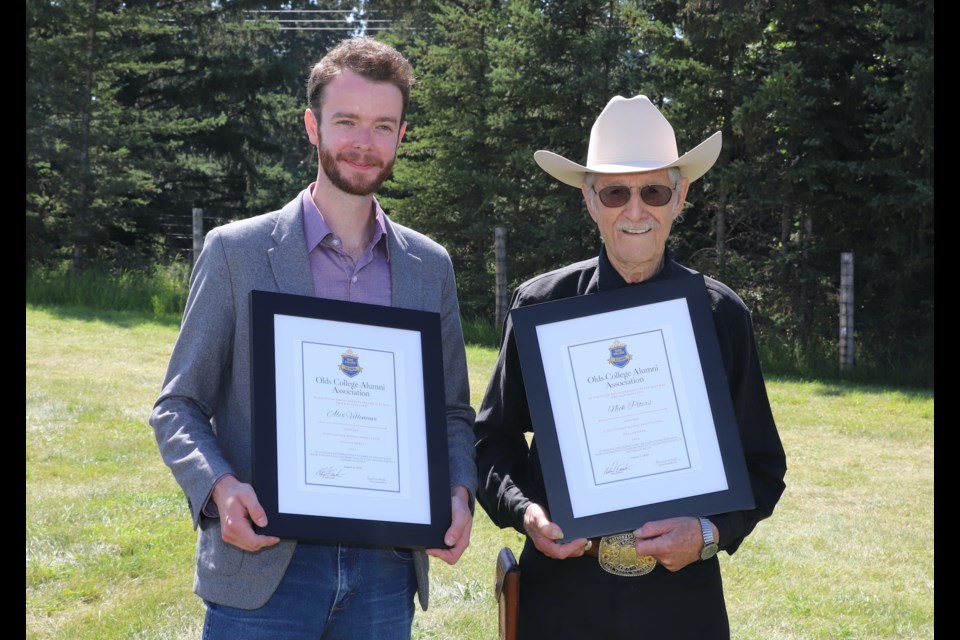 Former Olds College student Alex Villeneuve, left, and former instructor Nick Peters pose after being inducted in the college’s Hall of Merit and Hall of Fame respectively.