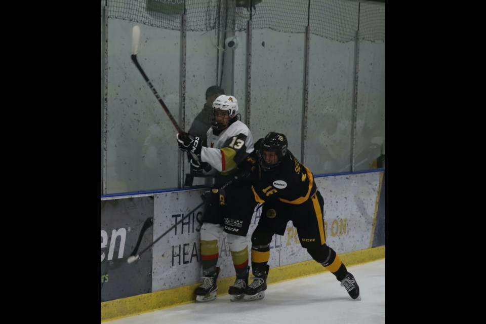 Olds Grizzlys forward Connor Seeley crushes Bonnyville Pontiacs D-man Dante Siciliano into the boards during a game between the Grizzlys and Pontiacs Friday, Dec. 15 in Olds.