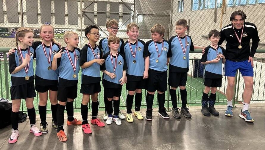 The Blue U11 Olds Minor Soccer team displays its gpld medals.
Photo submitted