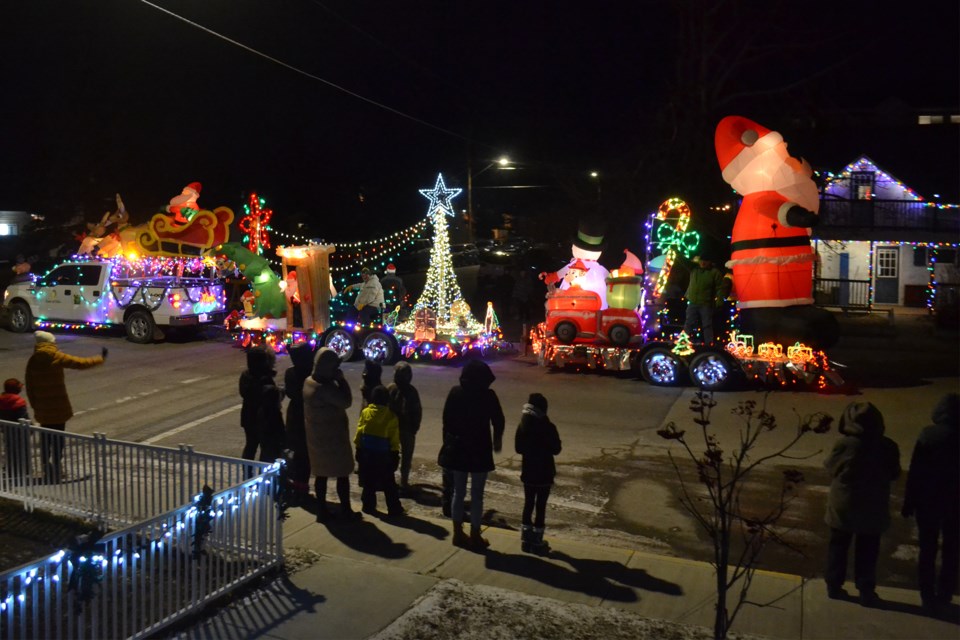 Crowds gathered along streets in Olds to watch the Santa Claus Parade of Lights, held Nov. 20. The Olds Fashioned Christmas committee also hosted a Winter Wonderland Walk Through at the Cow Palace Event Centre that evening. 
Doug Collie/MVP Staff