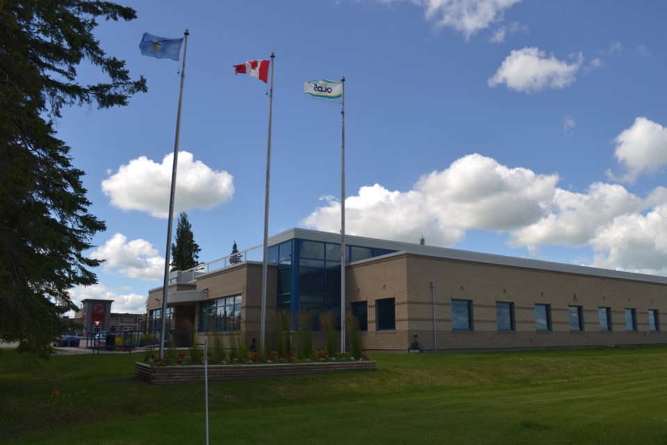 A look at the provincial, Canadian, and town flags that currently fly outside town hall. Council has discussed the possibility of flying a Treaty 7 and possibly a Metis flag there as well.