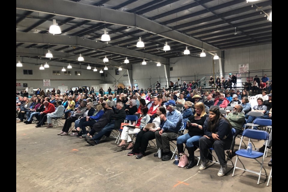 Audience members listen to UCP leadership candidates during the Mountain View Freedom sponsored forum in the Cow Palace in Olds on June 27.