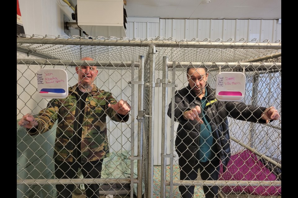 Josh Bauer from Alberta Power Sports, left, and Danny Caria, owner of Villa Maria Italian Restaurant were among 10 people 'arrested' as part of the Pawsitive Haven Animal Rescue's jail and bail fundraiser. Bauer was arrested for selling the fastest motorcycles on the planet while Caria was brought in for making the best Italian food and providing the best customer service. Bail was set at $500 per convict for a goal of $5,000.
Photo courtesy of Heather Tolley Photography