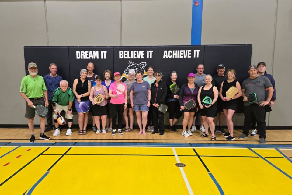 Pickleball players pose for a photo during the Carstairs tourney.
