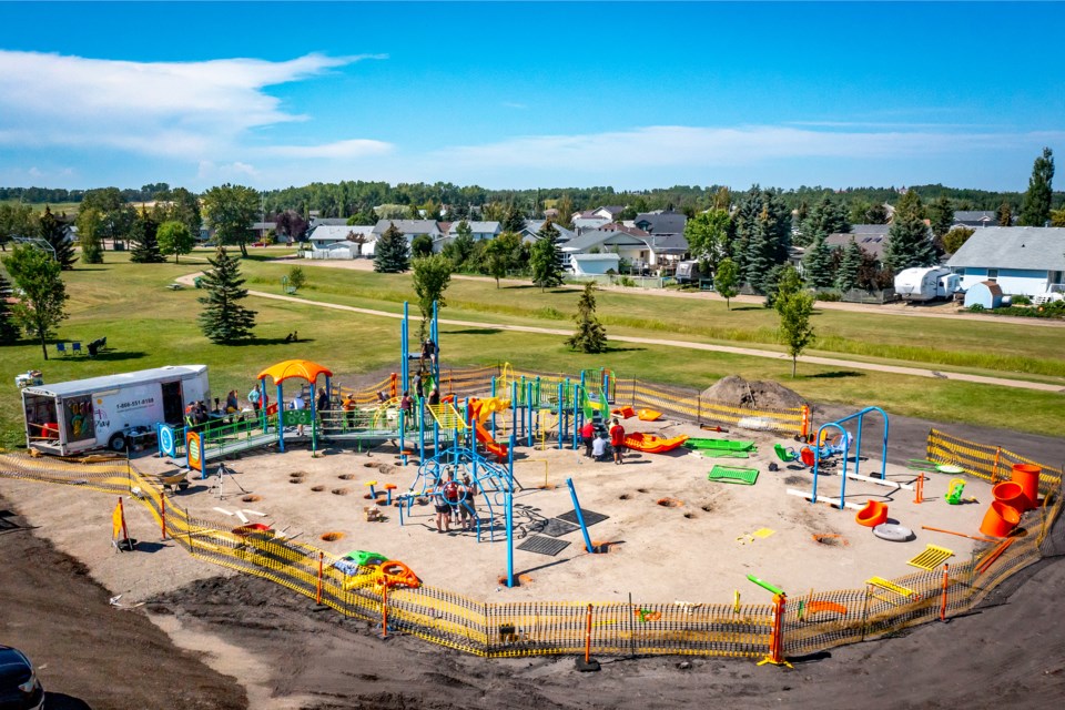 An aerial photo of work being done on Aug. 11 by volunteers to install the new all-inclusive playground at the Napoleon Park Sports Fields behind the Innisfail Twin Arena. Photo courtesy of Elevate UAV