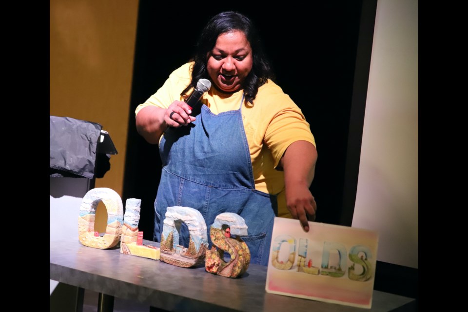 Renu Mathew displays the painting and OLDS letters she made in practice for one of the challenges on The Great Canadian Pottery Throw Down.