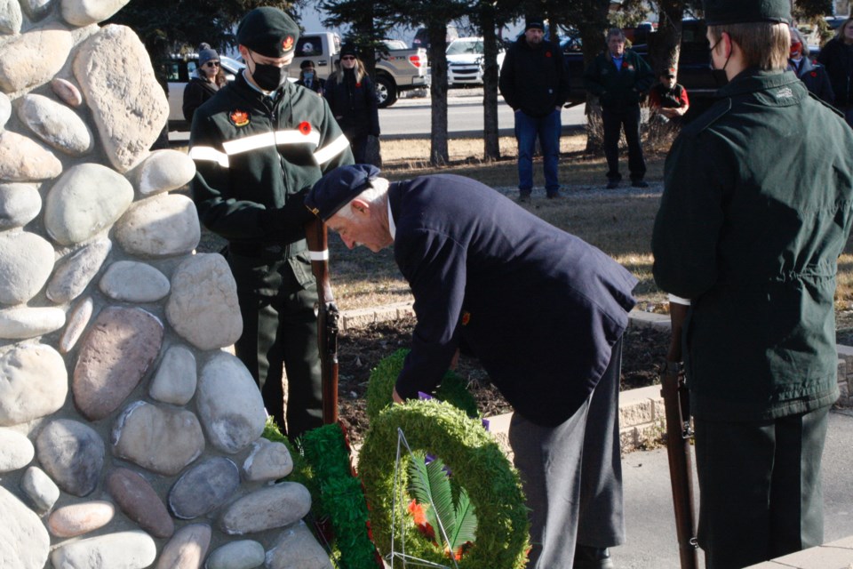SERVICE IN SUNDRE - Royal Canadian Legion Sundre Branch #23 member Bob Pearce lays a wreath during an outdoor Remembrance Day service in Sundre on Nov. 11. 
Simon Ducatel/MVP Staff