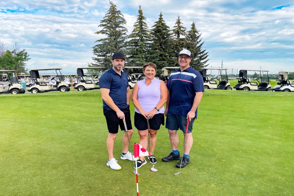 Members of the Rotary Club of Innisfail get ready on July 7 to golf at the Innisfail Golf Club for a great cause; fundraising for a new outdoor rink for the community. From left to right is tournament organizer James O'Dwyer, club president Tammy Thompson and Rotary past president Andrew Ritson-Bennett. Johnnie Bachusky/MVP Staff