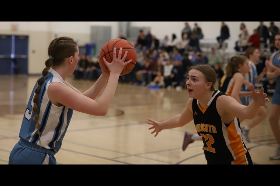 Grade 11 student Grace Killam of the Royals looks for a teammate to pass the ball to
during their semi-final game versus the Bawlf  Wildcats.
Doug Collie/MVP Staff