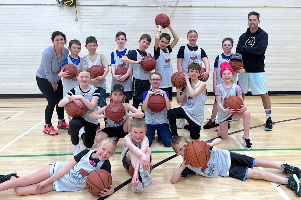 The players on the new Small Hoops in Sundre team had ball and enthusiastically posed for a team photo after their inaugural season's windup game against the Grade 6 girls from River Valley School. 
Courtesy of Anna Rozenhart