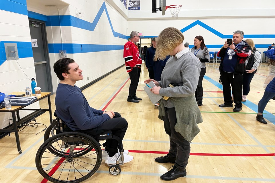 Following his presentations at the Innisfail Schools Campus, Ryan Straschnitzki was approached by many students who wanted to offer best wishes and to have photos taken with the former junior hockey player. Johnnie Bachusky/MVP Staff