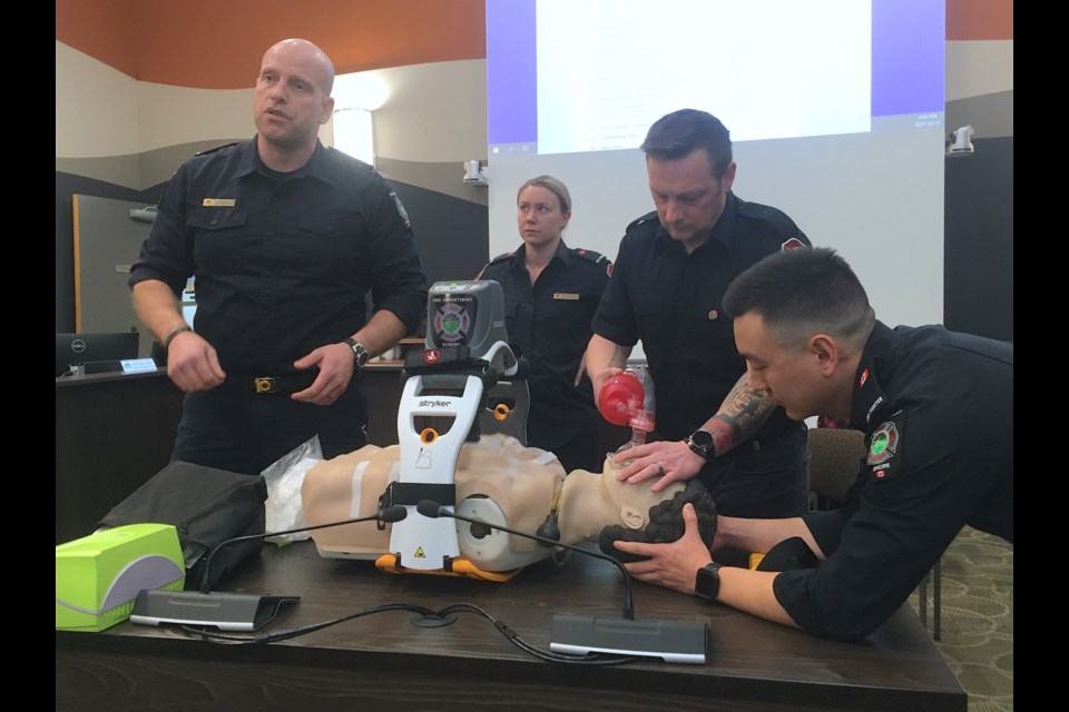 Members of the Sundre Fire Department demonstrate to the municipal council on Feb. 21 during a regular meeting how the recently acquired Lund University Cardiopulmonary Assist System (LUCAS ) device works. From left, firefighters Todd Marshall, Callie Klettl, Steven Ingram-Mitchell, and Sam Zhao.
Simon Ducatel/MVP Staff
