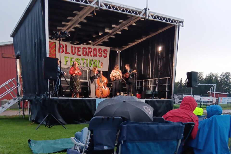 The weather was all over the place this past weekend at the Sundre Rodeo Grounds during the return of the Shady Grove Bluegrass Music Festival, a three-day outdoor concert put on by the Foothills Bluegrass Music Society. Despite some rain on Friday’s opening performances, there was “a good bunch of hearty folks that made it right till 10 o’clock,” said organizer Eric Holt. Photo courtesy of Eric Holt